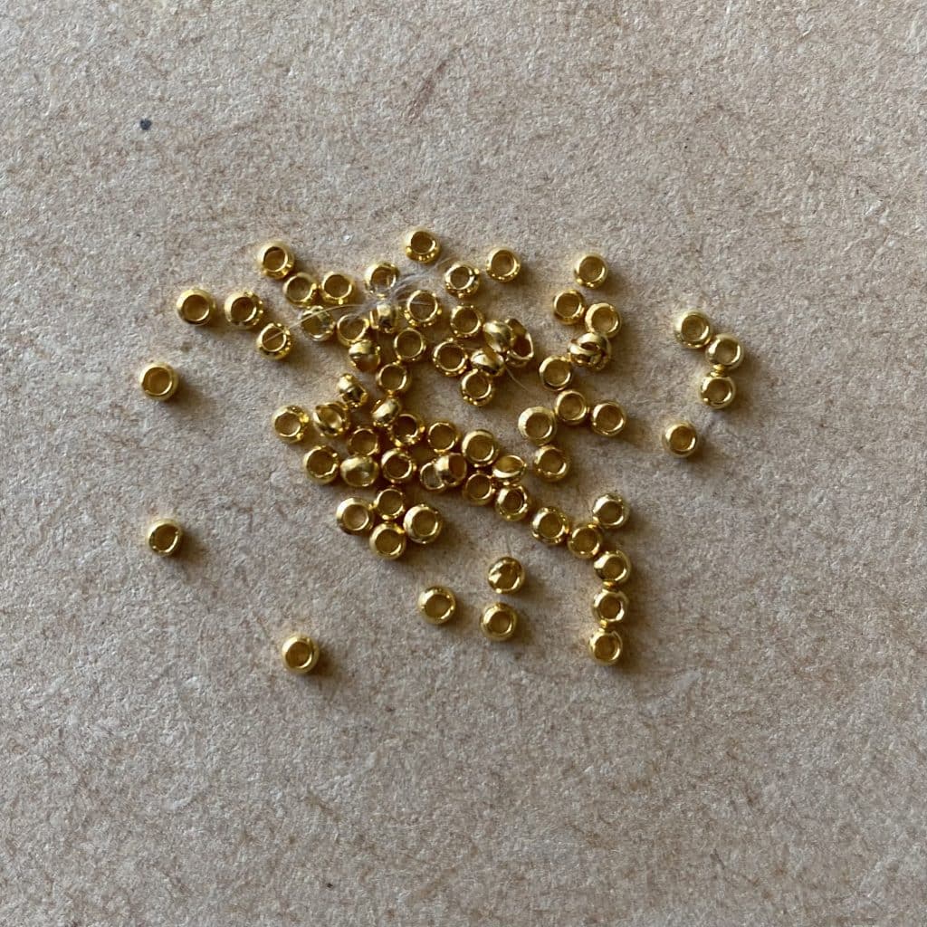 Bibliothèque - Nos Apprêts - Billes de séparation doré - les pierres de tao - bijoux - fait main - lithothérapie - pierres fines - pierres naturelles - boutique - france